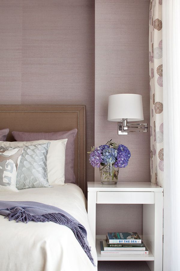 Mauve bedroom with subtle patterned wallpaper