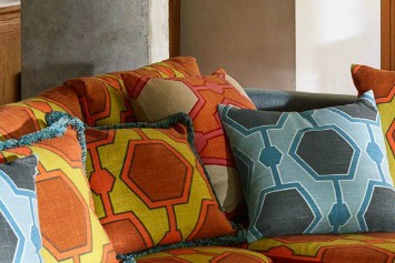 orange and red stripe cushions and sofa