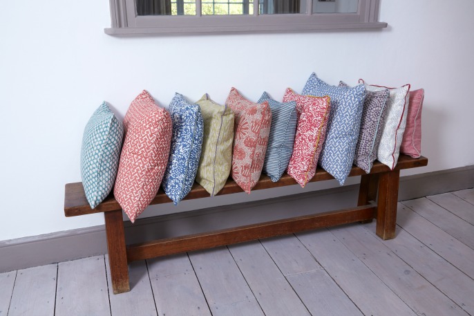 row of patterned cushion, red, green, blue, yello